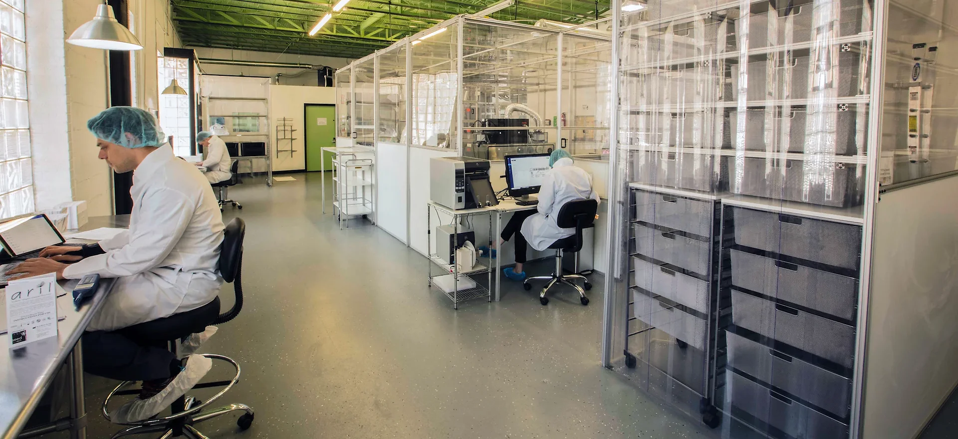 A technician processing amniotic membrane tissue in a cleanroom