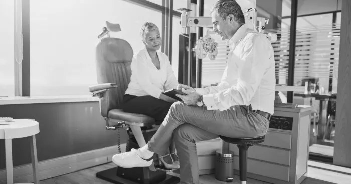 An ophthalmologist consulting with a patient in an eye-care clinic